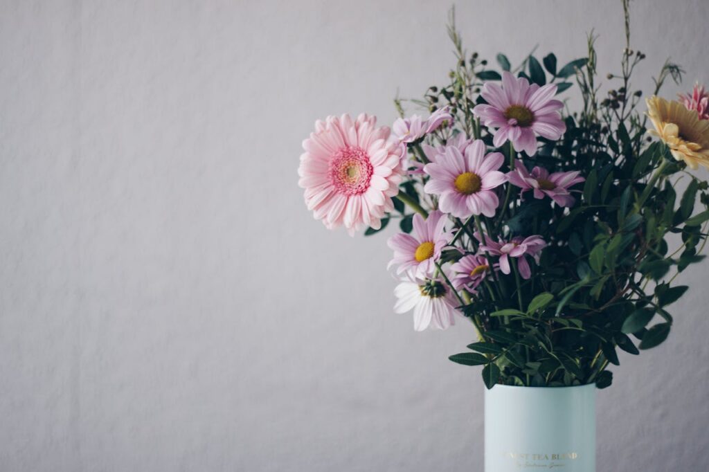 Mastering the First Impression: Your intriguing post title goes here A stunning bouquet of pink gerbera daisies in a stylish vase against a soft background.