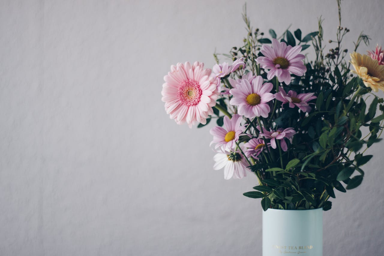 Mastering the First Impression: Your intriguing post title goes here A stunning bouquet of pink gerbera daisies in a stylish vase against a soft background.